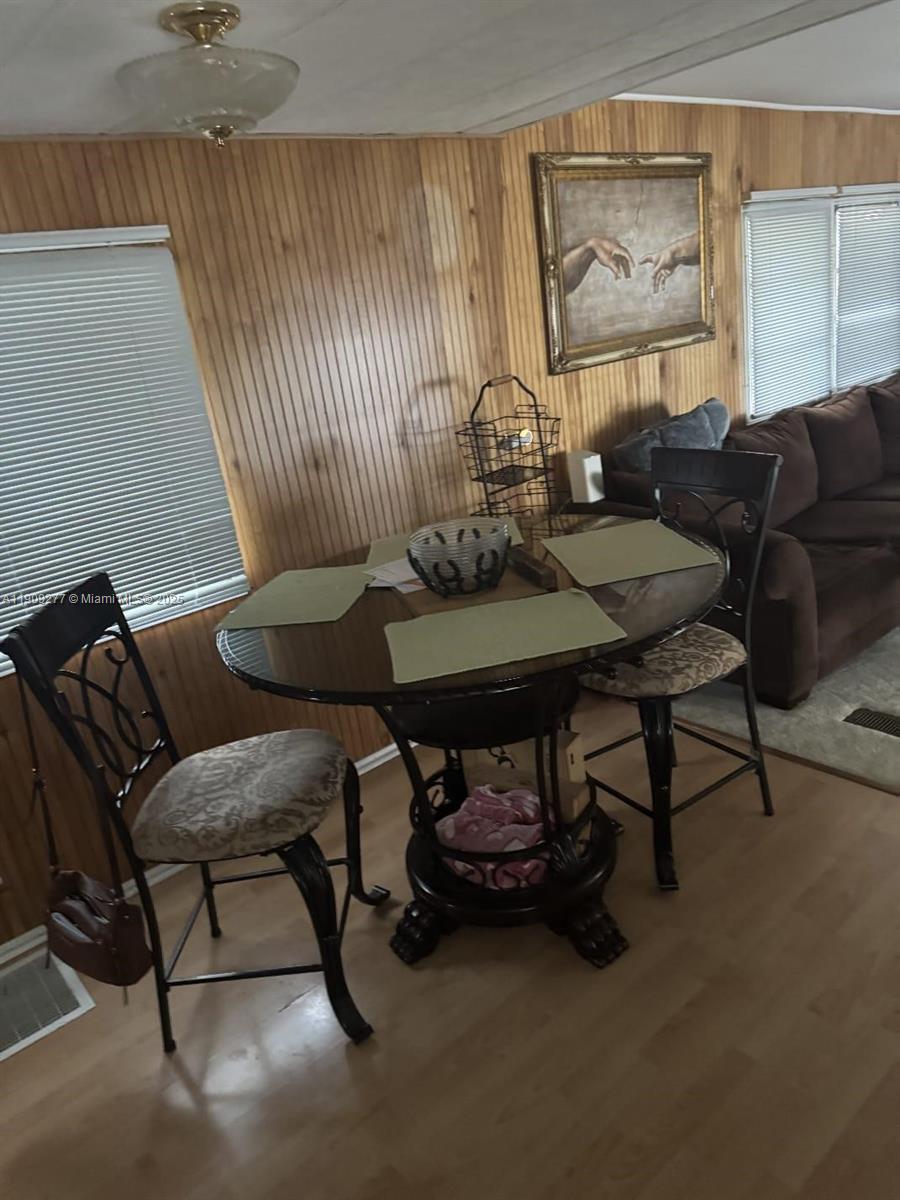 5470 Southwest 25th Way, Unit 5470 Dania Beach, FL 33312 - Photo 9 of 15 a living room with furniture and wooden floor
