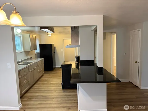 a view of living room with furniture and a fireplace