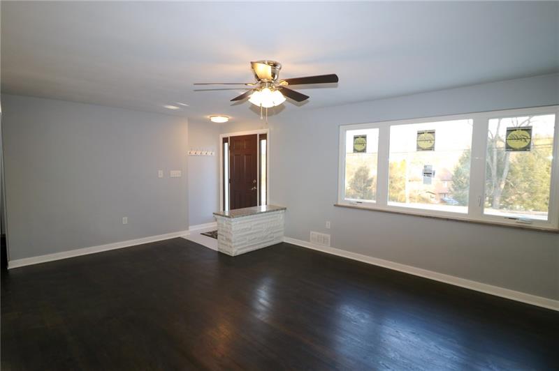 2279 Rochester Road Pittsburgh, PA 15237 - Photo 3 of 25 Enter into the Living Room from the New Front Door and be Greeted by New Windows, Lighted Ceiling Fan, and Beautifully Refinished Hardwood Floors.