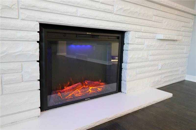 2279 Rochester Road Pittsburgh, PA 15237 - Photo 6 of 25 An Electric Fireplace has been Installed for Efficient Heating and Ambiance. Enjoy Added Warmth by Turning on the Blower....