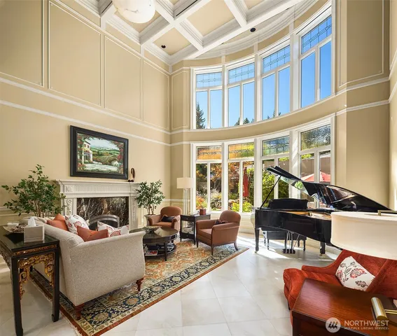 a living room with furniture windows and a fireplace