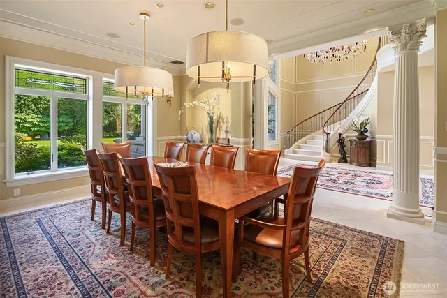 a dining room with furniture a chandelier and wooden floor