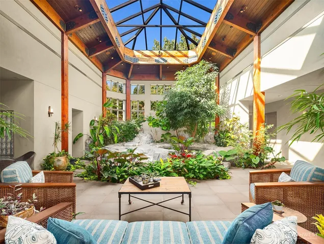 a view of a chair and tables in patio