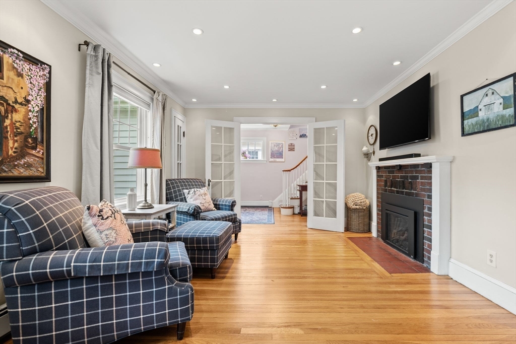15 Grace Road Medford, MA 02155 - Photo 16 of 41 a living room with furniture fireplace and flat screen tv