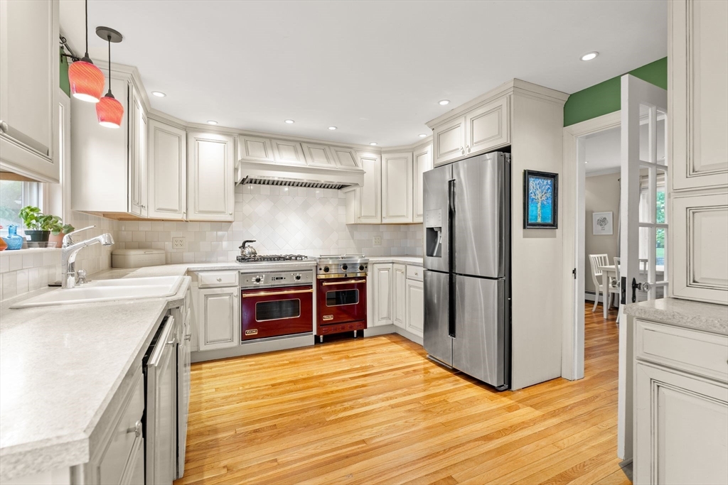 15 Grace Road Medford, MA 02155 - Photo 2 of 41 a kitchen with a refrigerator sink and wooden floor