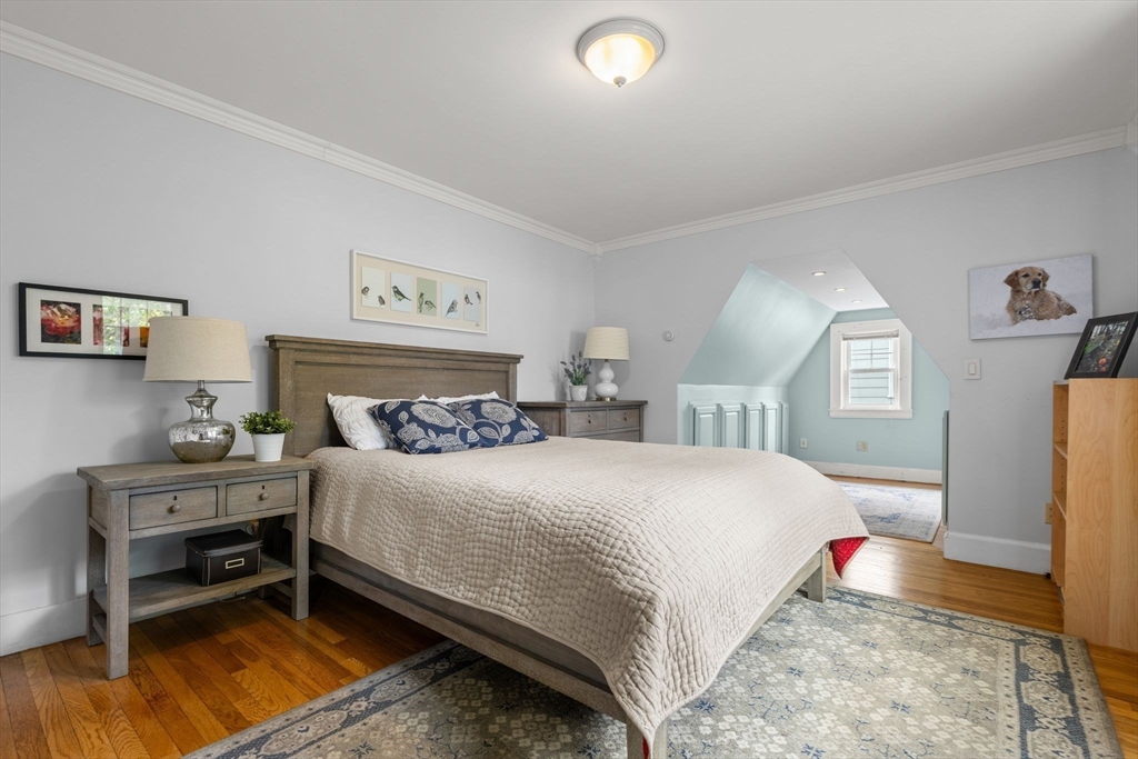 15 Grace Road Medford, MA 02155 - Photo 21 of 41 a bedroom with a bed and wooden floor