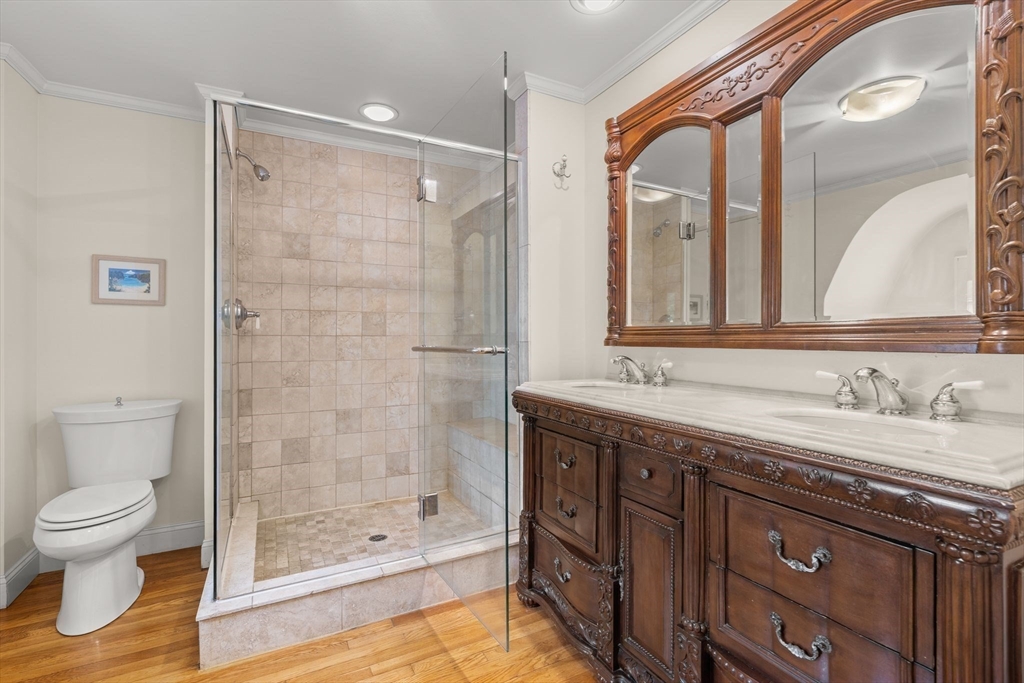 15 Grace Road Medford, MA 02155 - Photo 24 of 41 a bathroom with a granite countertop sink toilet and shower