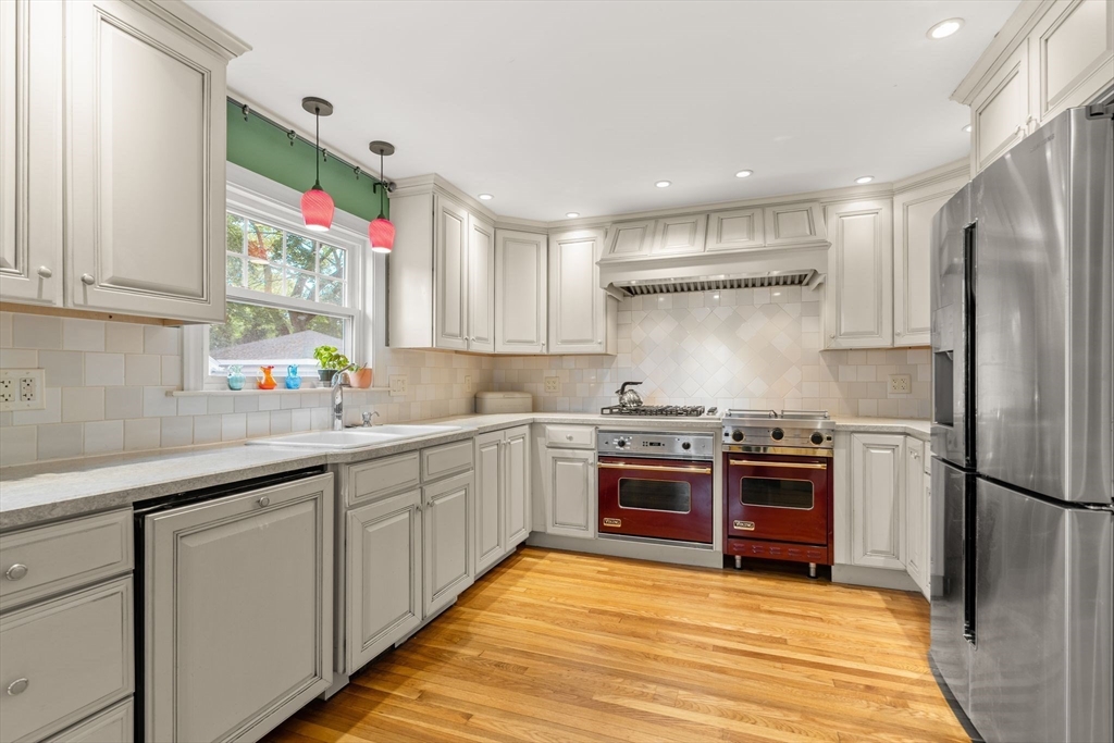 15 Grace Road Medford, MA 02155 - Photo 3 of 41 a kitchen with stainless steel appliances granite countertop a sink and a stove