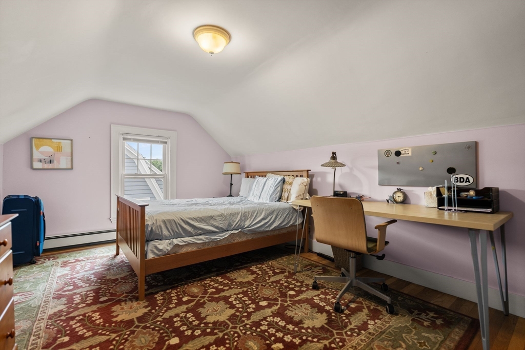 15 Grace Road Medford, MA 02155 - Photo 33 of 41 a bedroom with a bed and wooden floor