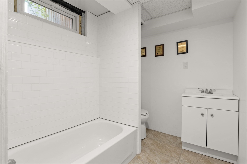 15 Grace Road Medford, MA 02155 - Photo 35 of 41 a bathroom with a bathtub and sink