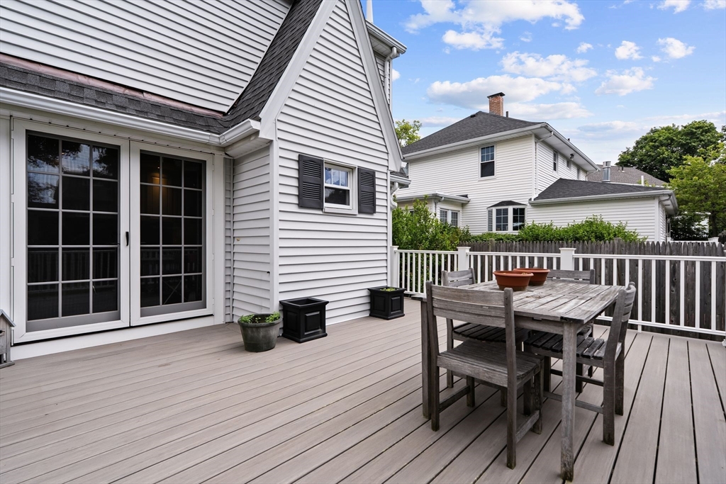 15 Grace Road Medford, MA 02155 - Photo 37 of 41 a view of a house with wooden deck and furniture