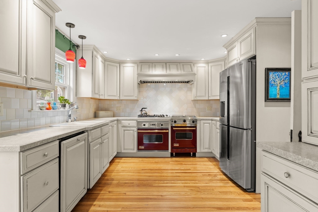 15 Grace Road Medford, MA 02155 - Photo 4 of 41 a kitchen with stainless steel appliances granite countertop a refrigerator and a sink