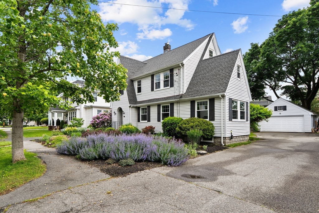 15 Grace Road Medford, MA 02155 - Photo 41 of 41 a front view of a house with a garden and trees
