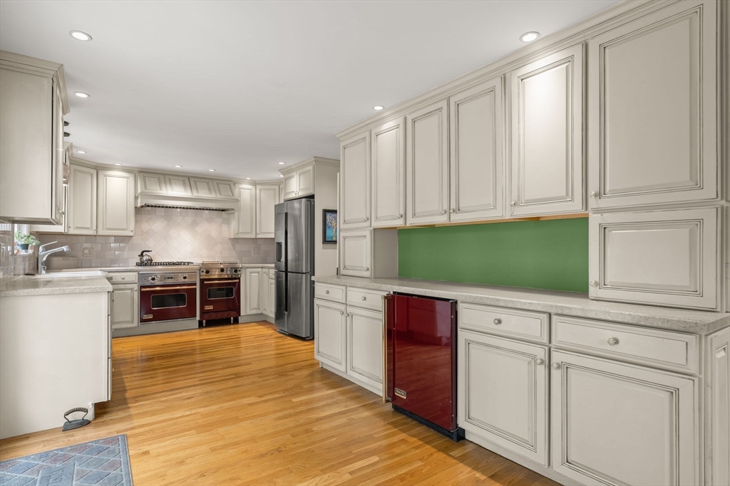 15 Grace Road Medford, MA 02155 - Photo 6 of 41 a kitchen with stainless steel appliances granite countertop a refrigerator sink and cabinets