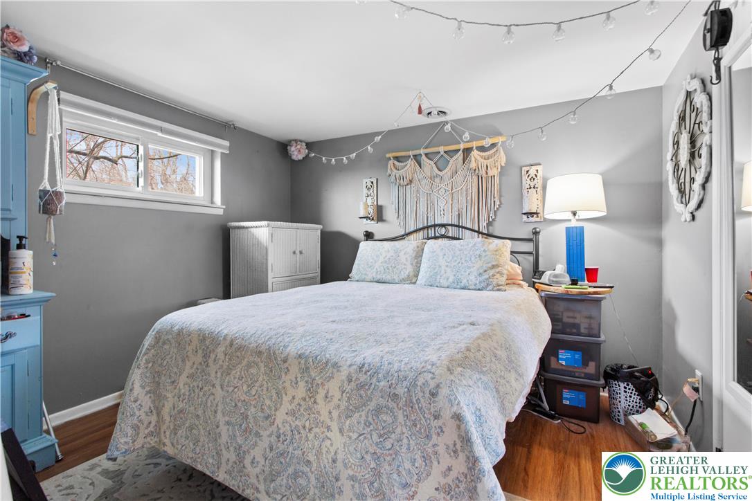 910 Gall Road Easton, PA 18040 - Photo 15 of 30 a bedroom with a bed and a lamp on dresser