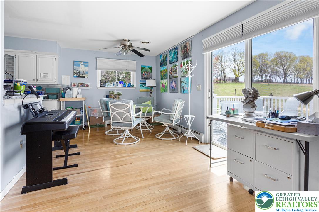910 Gall Road Easton, PA 18040 - Photo 4 of 30 a living room with furniture a wooden floor and a large window