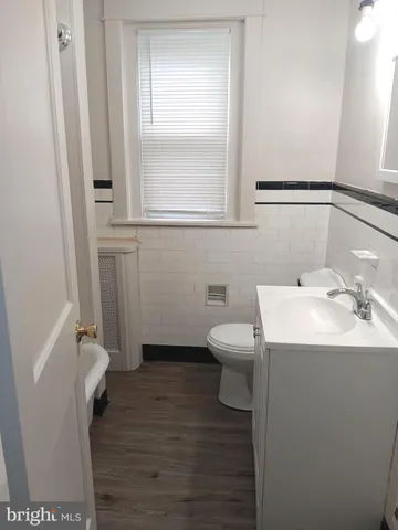 a bathroom with a sink toilet and vanity
