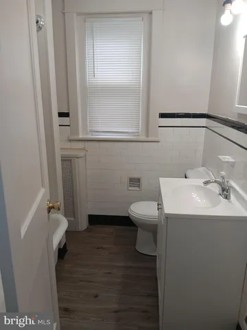 a bathroom with a sink toilet and vanity