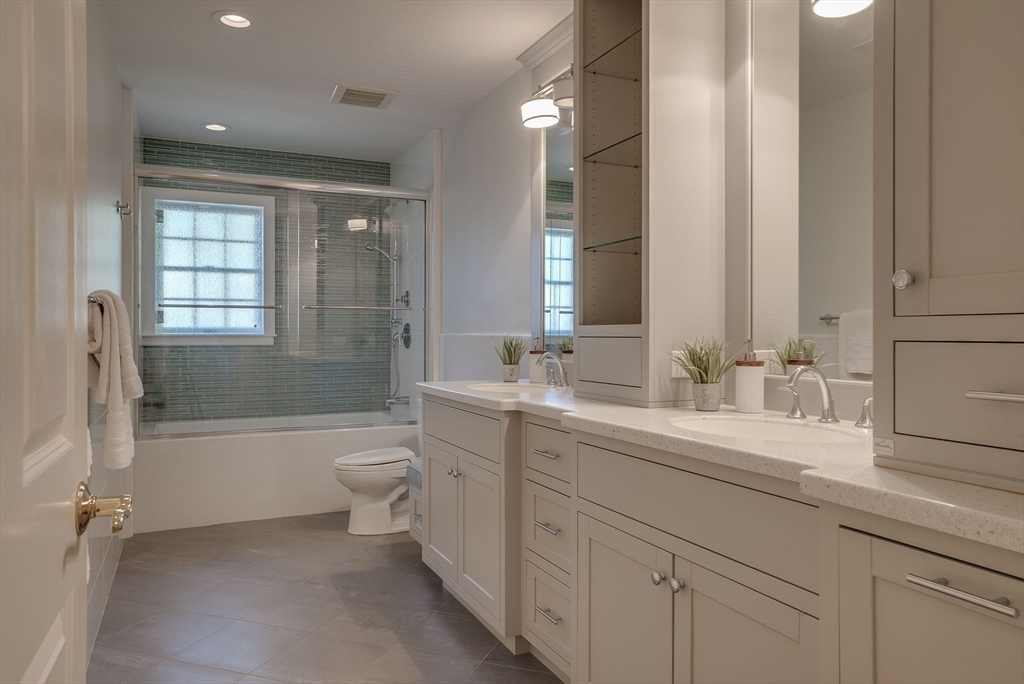 34 Middleby Road Lexington, MA 02421 - Photo 31 of 41 a bathroom with a bathtub shower sink mirror and toilet