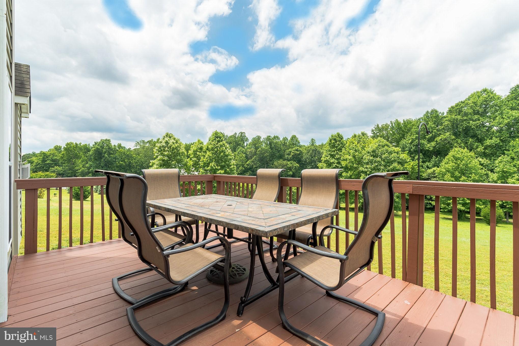 7420 Flint Hill Road Owings, MD 20736 - Photo 3 of 30 a balcony with wooden floor outdoor seating and nature