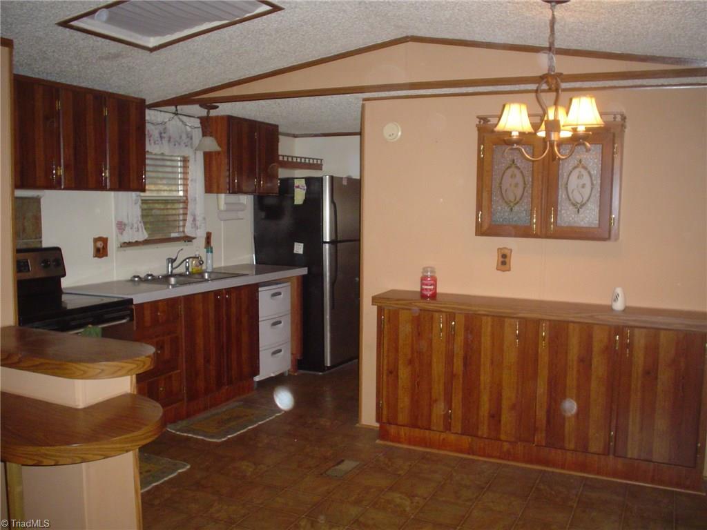 7107 Downsfield Road Randleman, NC 27317 - Photo 5 of 11 Eat-in Kitchen with Range-oven & Refrigerator