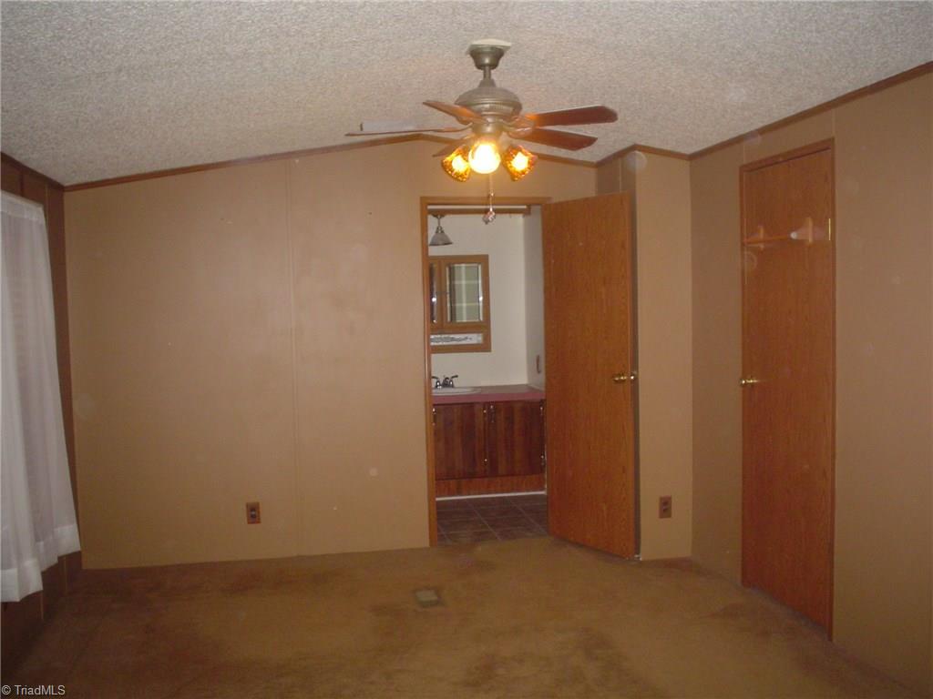 7107 Downsfield Road Randleman, NC 27317 - Photo 6 of 11 11' x 15'8" Master Bedroom
