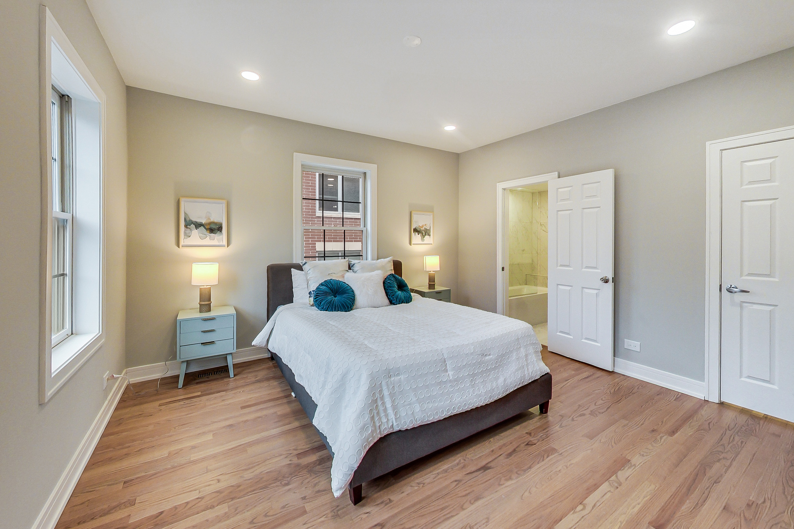 1036 West Monroe Street Chicago, IL 60607 - Photo 11 of 24 a bedroom with a bed and wooden floor