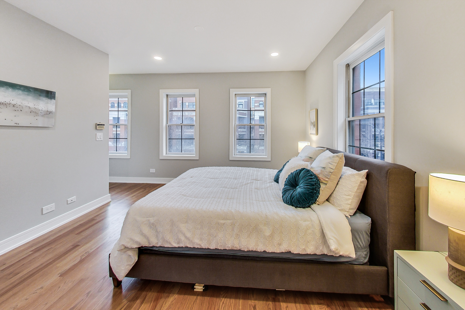 1036 West Monroe Street Chicago, IL 60607 - Photo 12 of 24 a bedroom with a large bed and a window