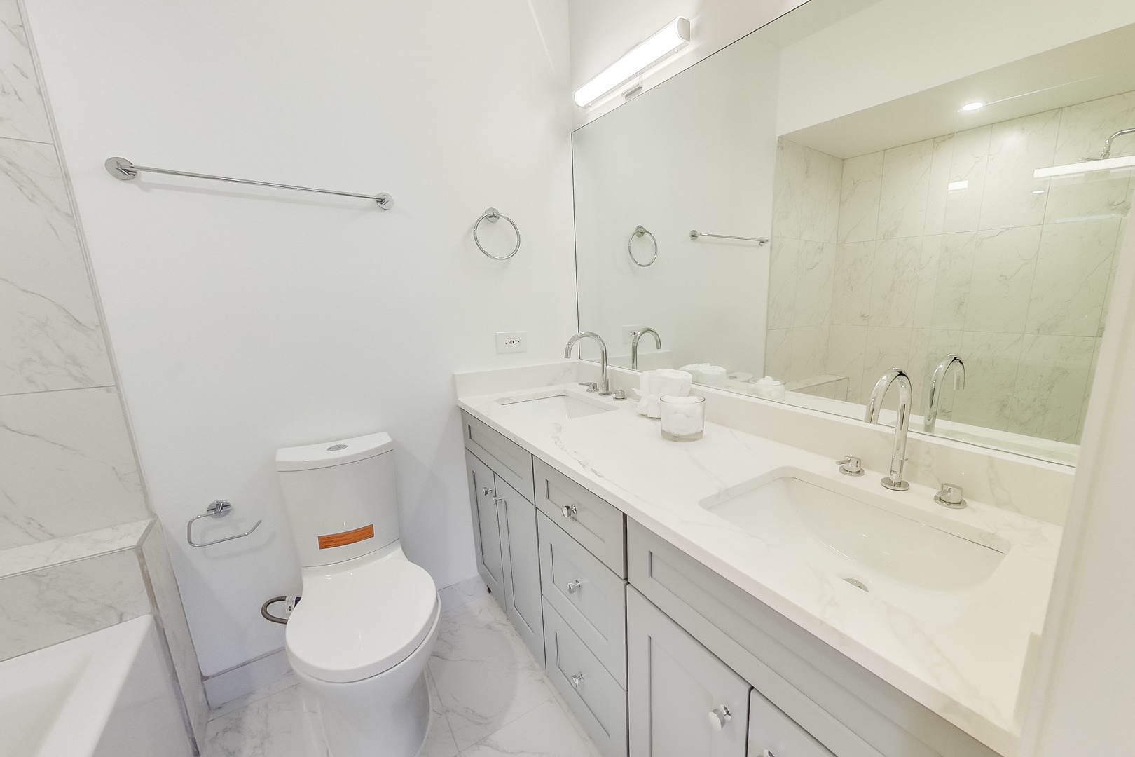 1036 West Monroe Street Chicago, IL 60607 - Photo 13 of 24 a bathroom with a sink toilet and shower