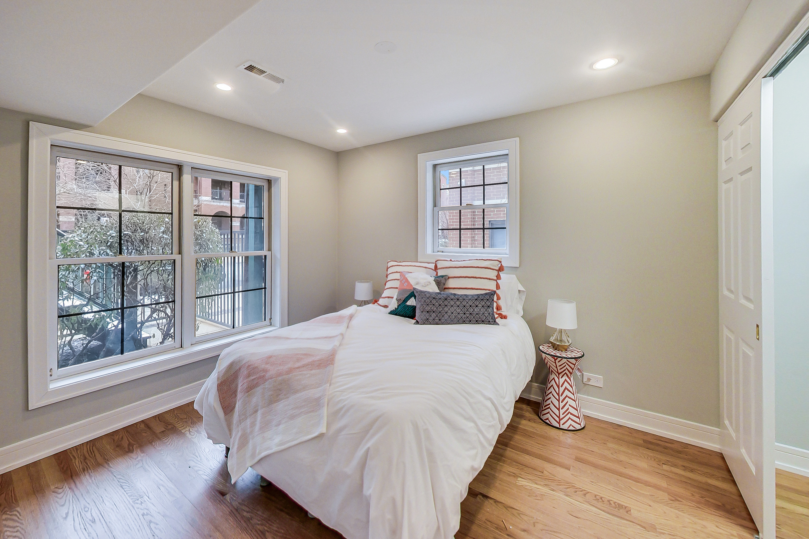 1036 West Monroe Street Chicago, IL 60607 - Photo 15 of 24 a bedroom with a bed and wooden floor