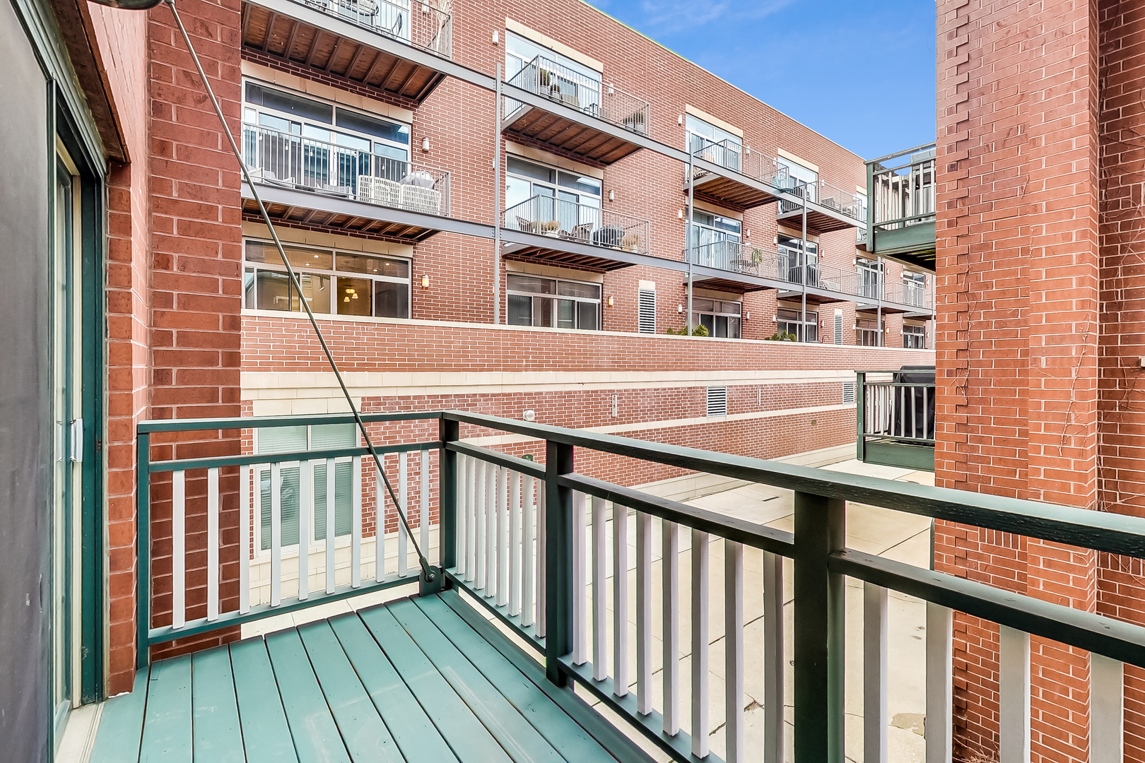 1036 West Monroe Street Chicago, IL 60607 - Photo 19 of 24 a view of a brick building from a balcony