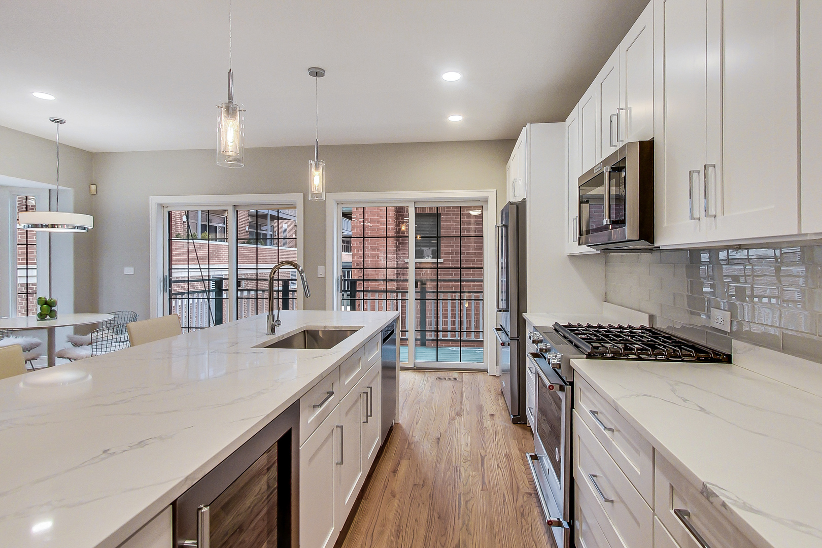 1036 West Monroe Street Chicago, IL 60607 - Photo 8 of 24 a kitchen with stainless steel appliances granite countertop a sink stove and cabinets