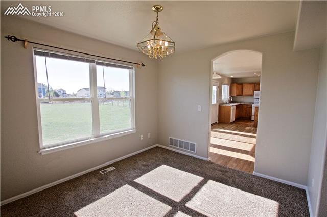 8461 Saddleman Road Peyton, CO 80831 - Photo 5 of 26 Formal dining room