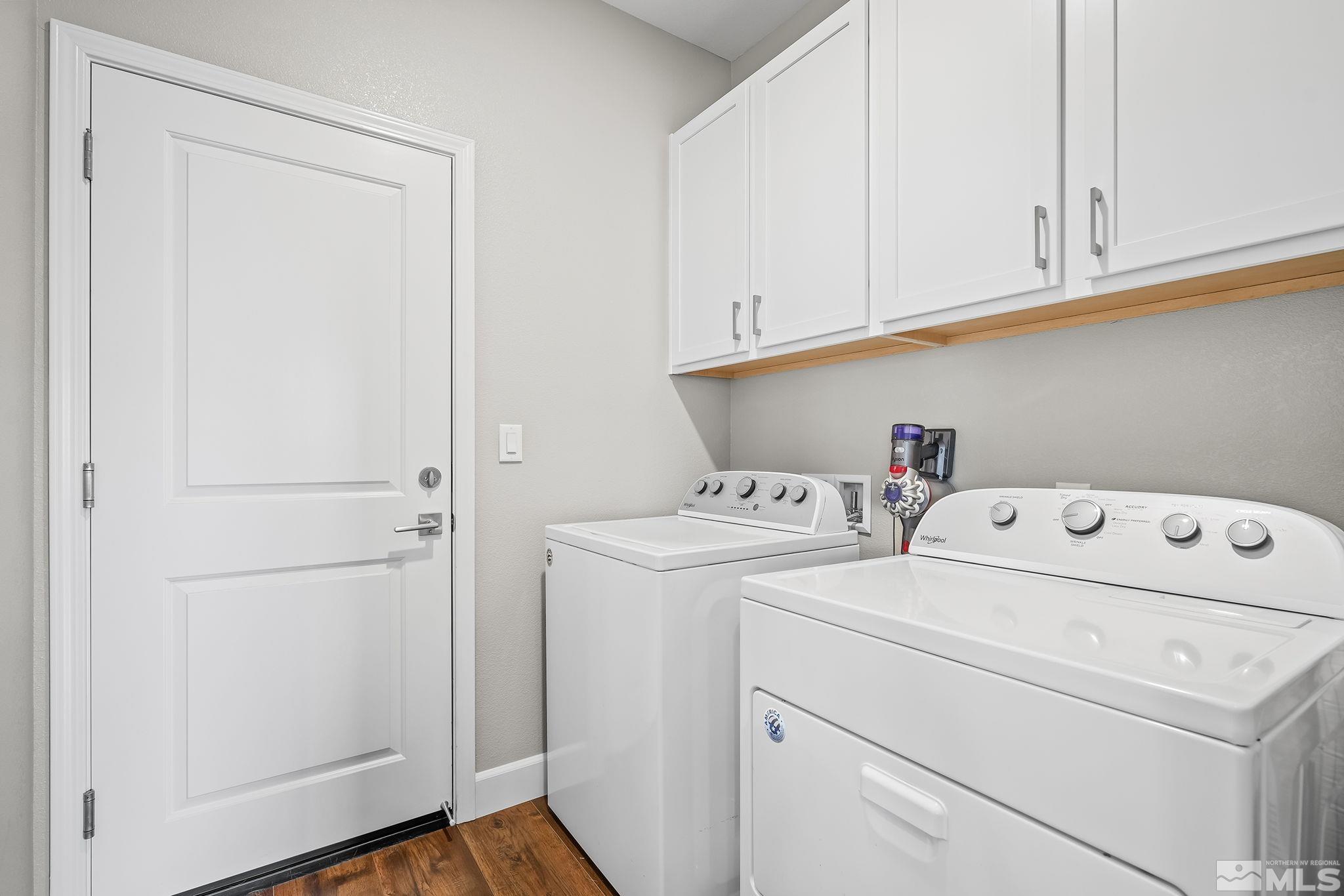 626 Riverbed Circle Reno, NV 89521 - Photo 21 of 27 a utility room with dryer and washer