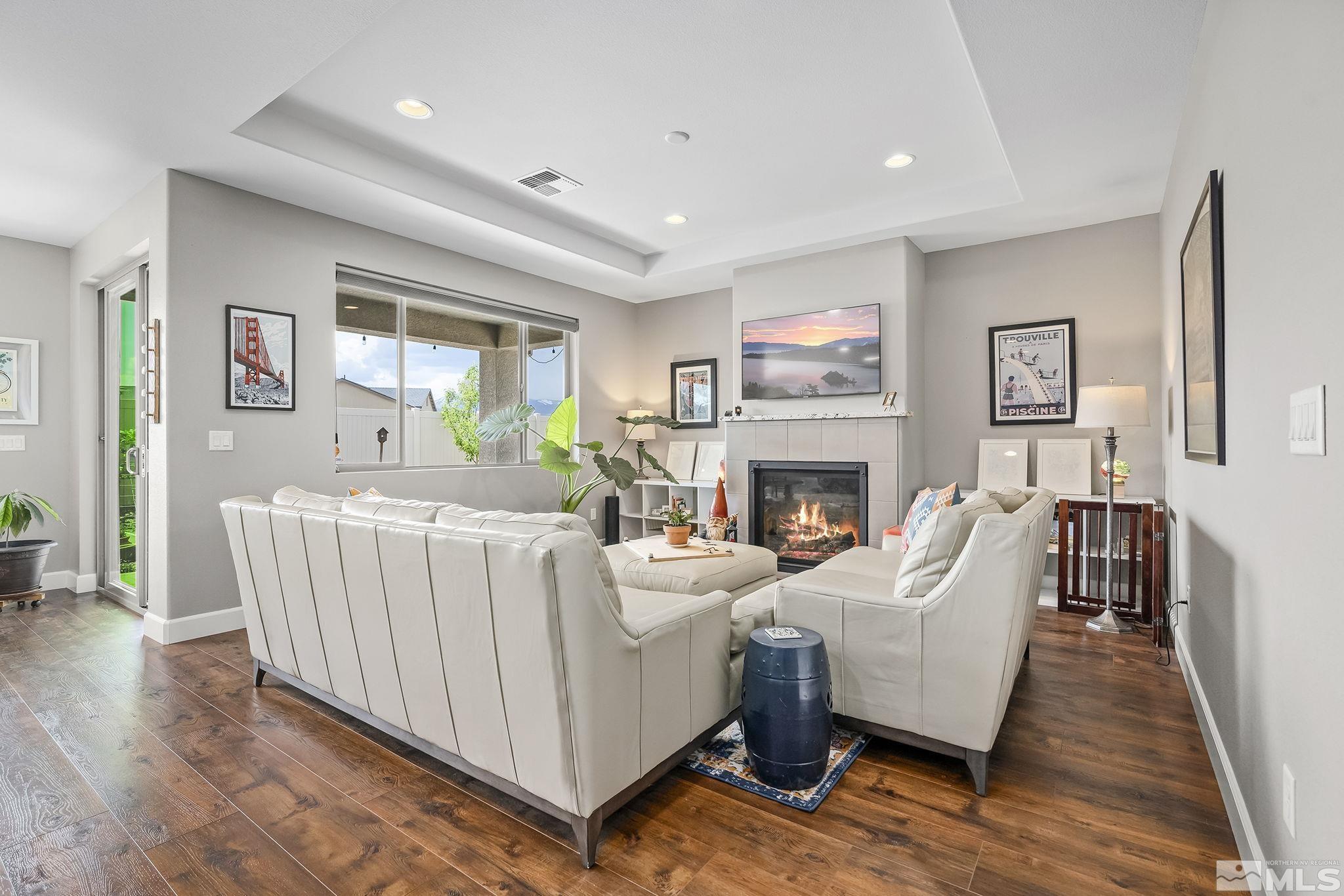 626 Riverbed Circle Reno, NV 89521 - Photo 3 of 27 a living room with furniture and a fireplace