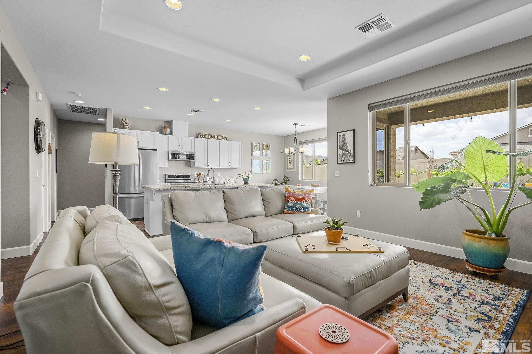 626 Riverbed Circle Reno, NV 89521 - Photo 5 of 27 a living room with furniture and a potted plant