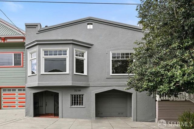 a front view of a house with a garage