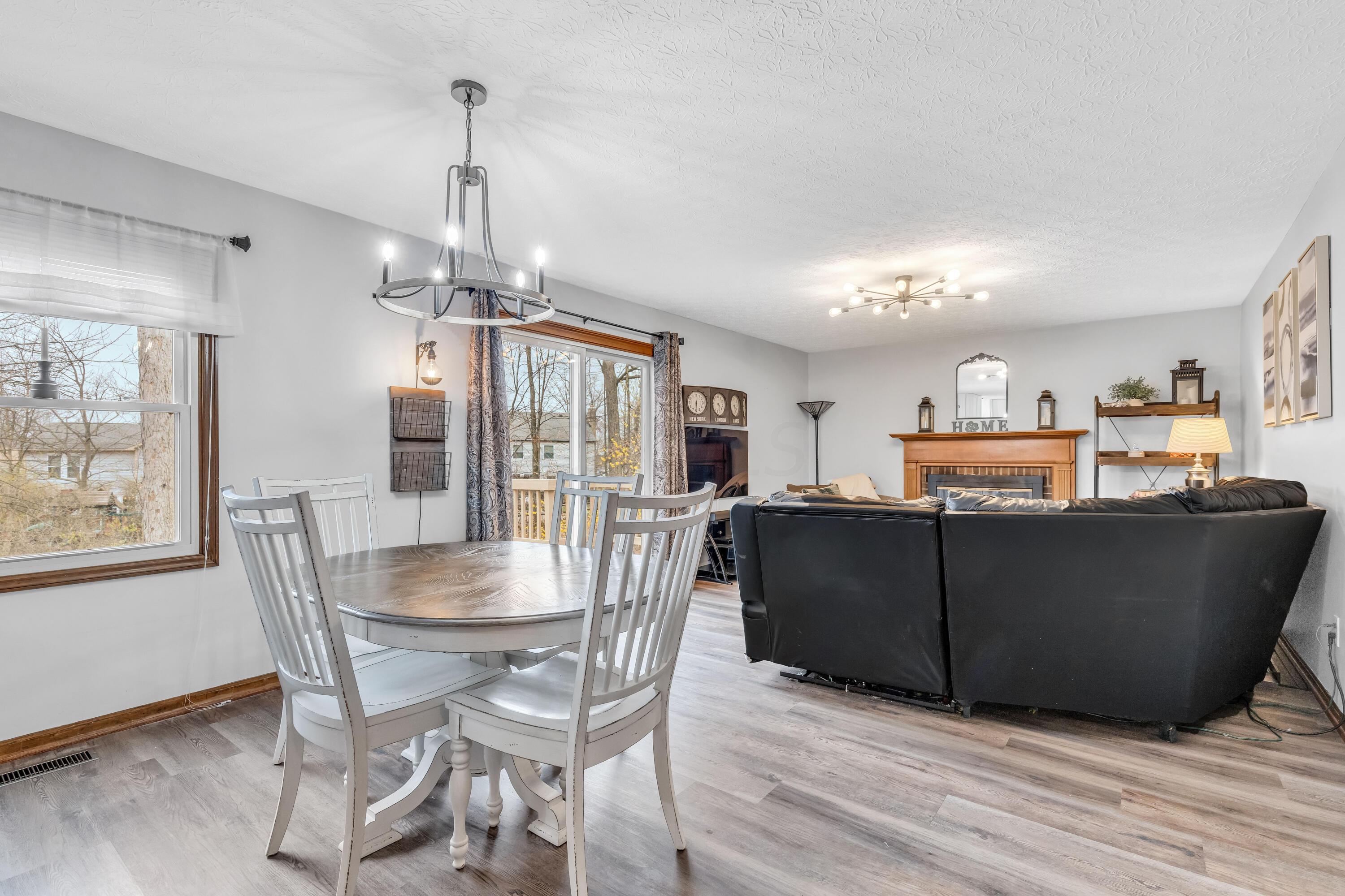 435 Emory Street Gahanna, OH 43230 - Photo 19 of 54 • New luxury vinyl plank
flooring ~ 2022
• Pale grey painted walls
• Chandelier
• Mini blinds