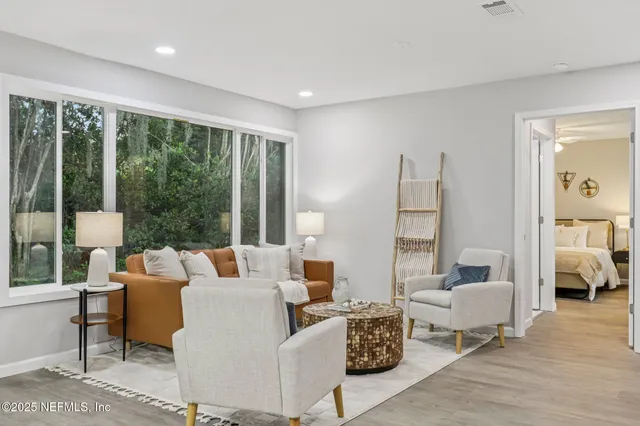 a view of a dining room with furniture and a livingroom