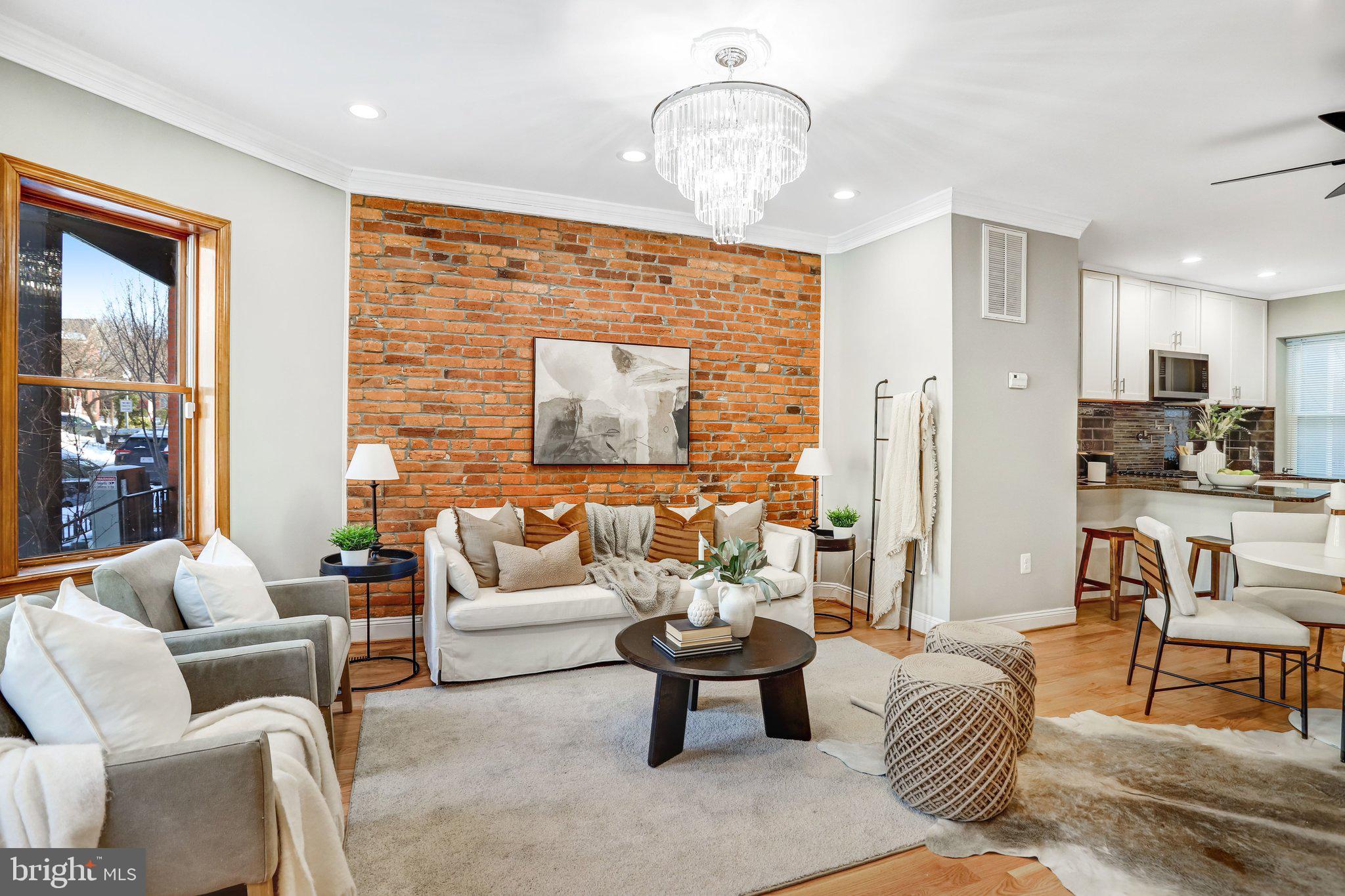 524 T Street Northwest Washington, DC 20001 - Photo 11 of 54 a living room with furniture wooden floor and a chandelier