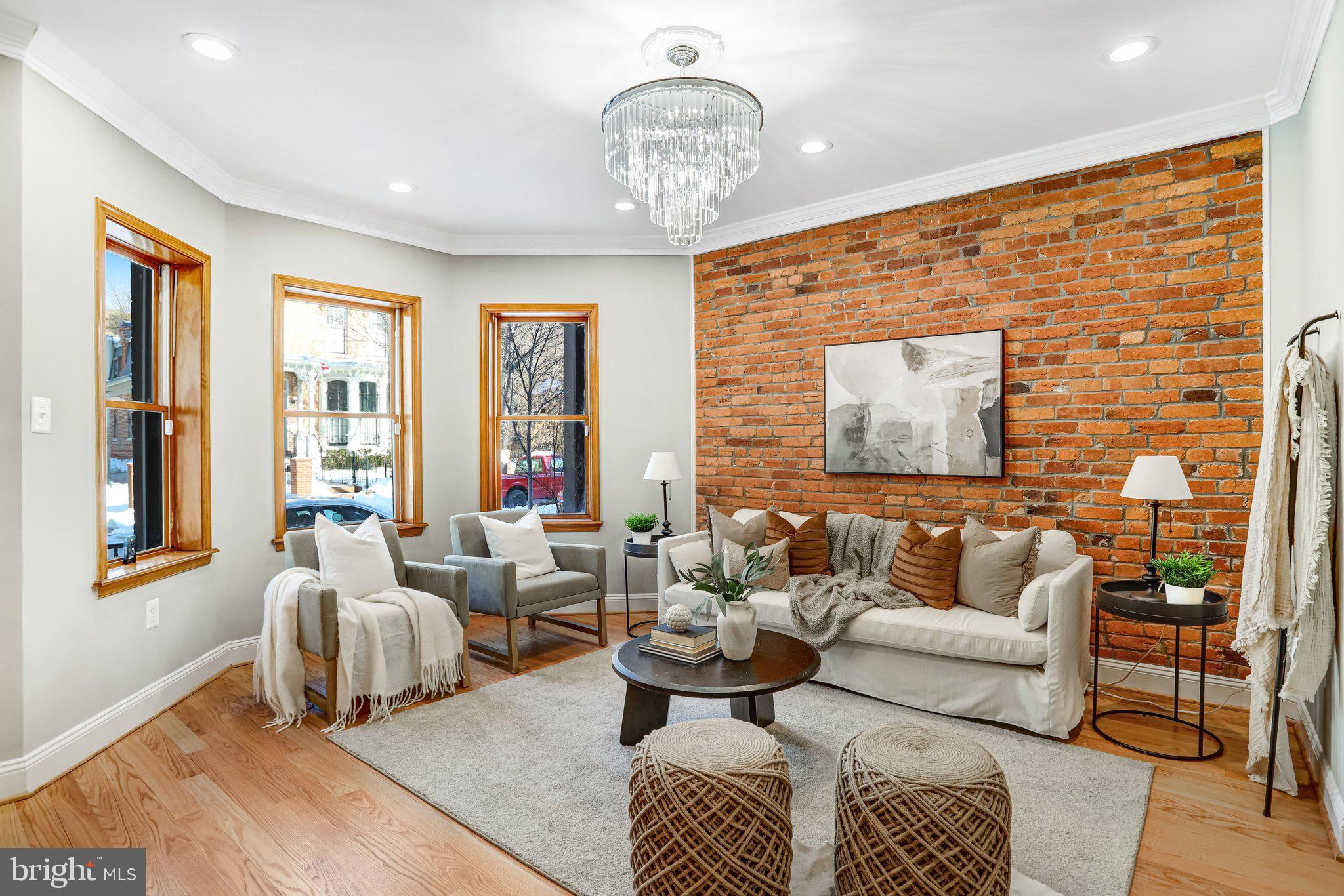 524 T Street Northwest Washington, DC 20001 - Photo 13 of 54 a living room with furniture chandelier and a large window