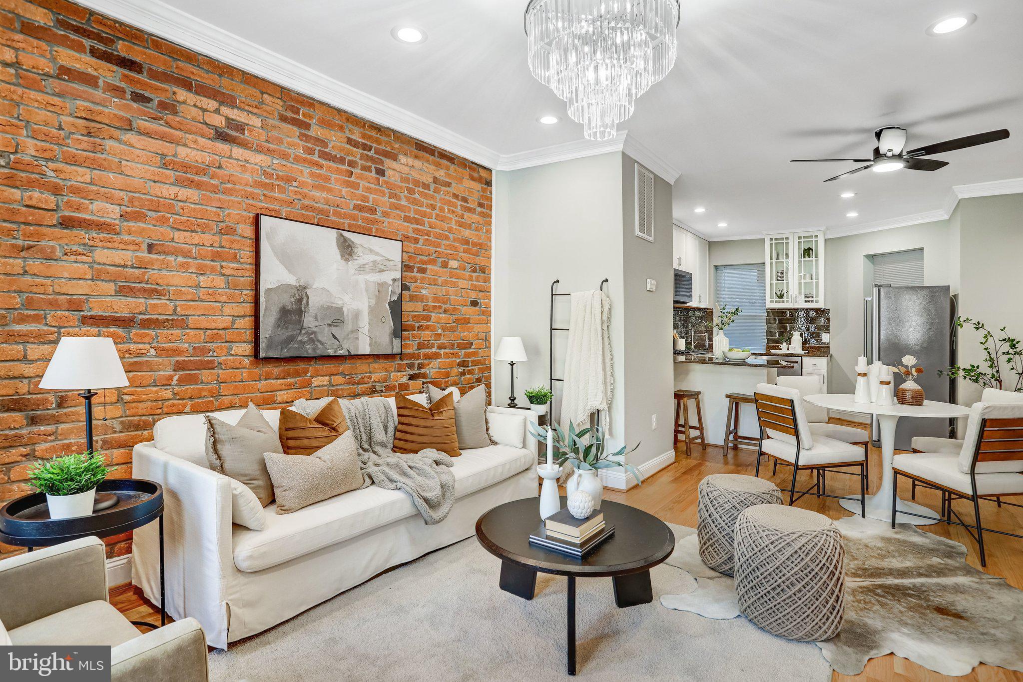 524 T Street Northwest Washington, DC 20001 - Photo 14 of 54 a living room with furniture and a chandelier