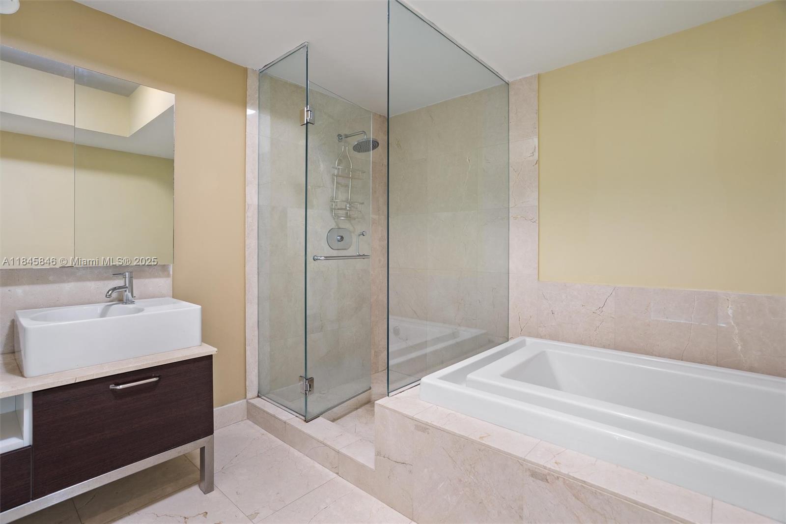 218 Southeast 14th Street, Unit 1904 Miami, FL 33131 - Photo 15 of 28 a spacious bathroom with a shower and a sink