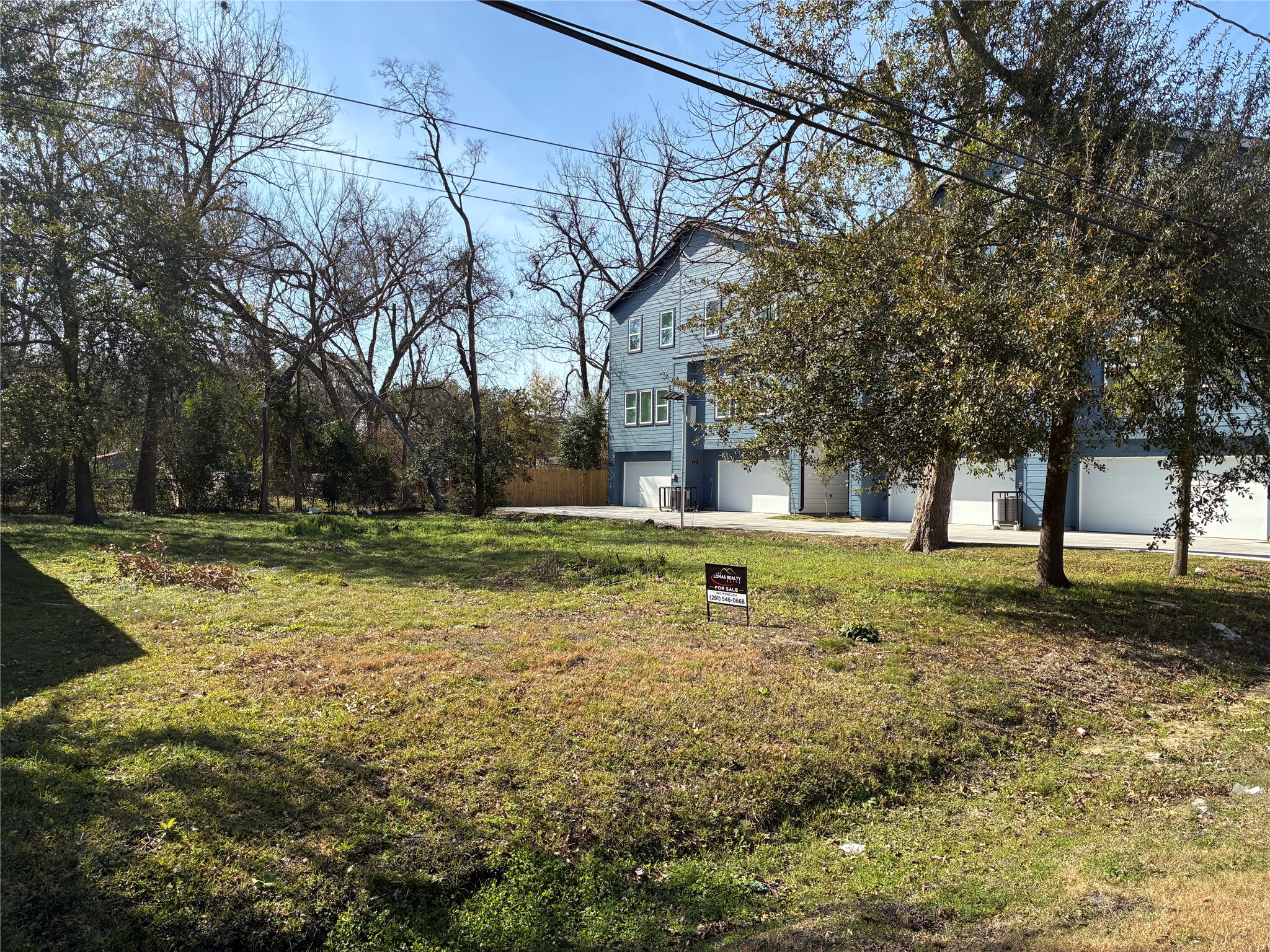 887 Lucky Street Houston, TX 77088 - Photo 2 of 6 a view of a house with a yard