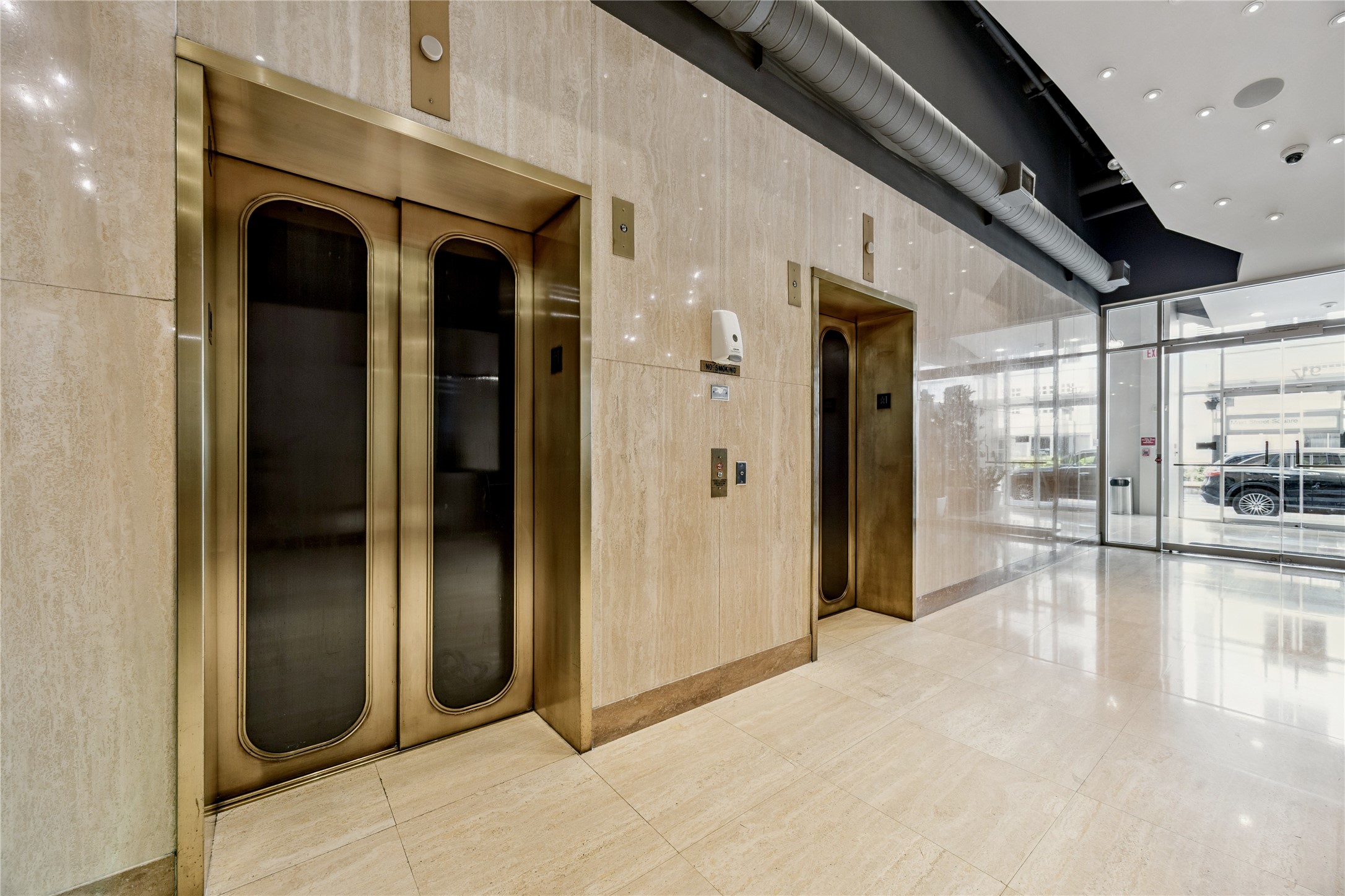 917 Main Street, Unit 1005 Houston, TX 77002 - Photo 11 of 14 a view of a hallway with glass doors