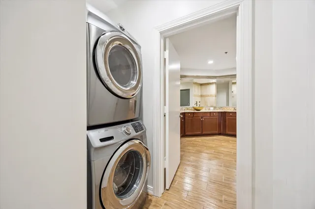 a view of a bedroom with washer and dryer