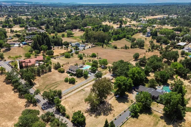 an aerial view of residential houses with outdoor space