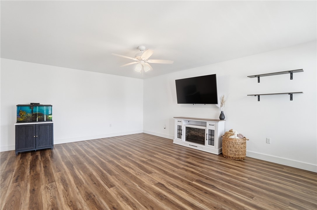 728 East Northern Avenue Springfield, OH 45503 - Photo 7 of 35 This living room features rich wood flooring, crisp white walls, and an inviting ambiance.