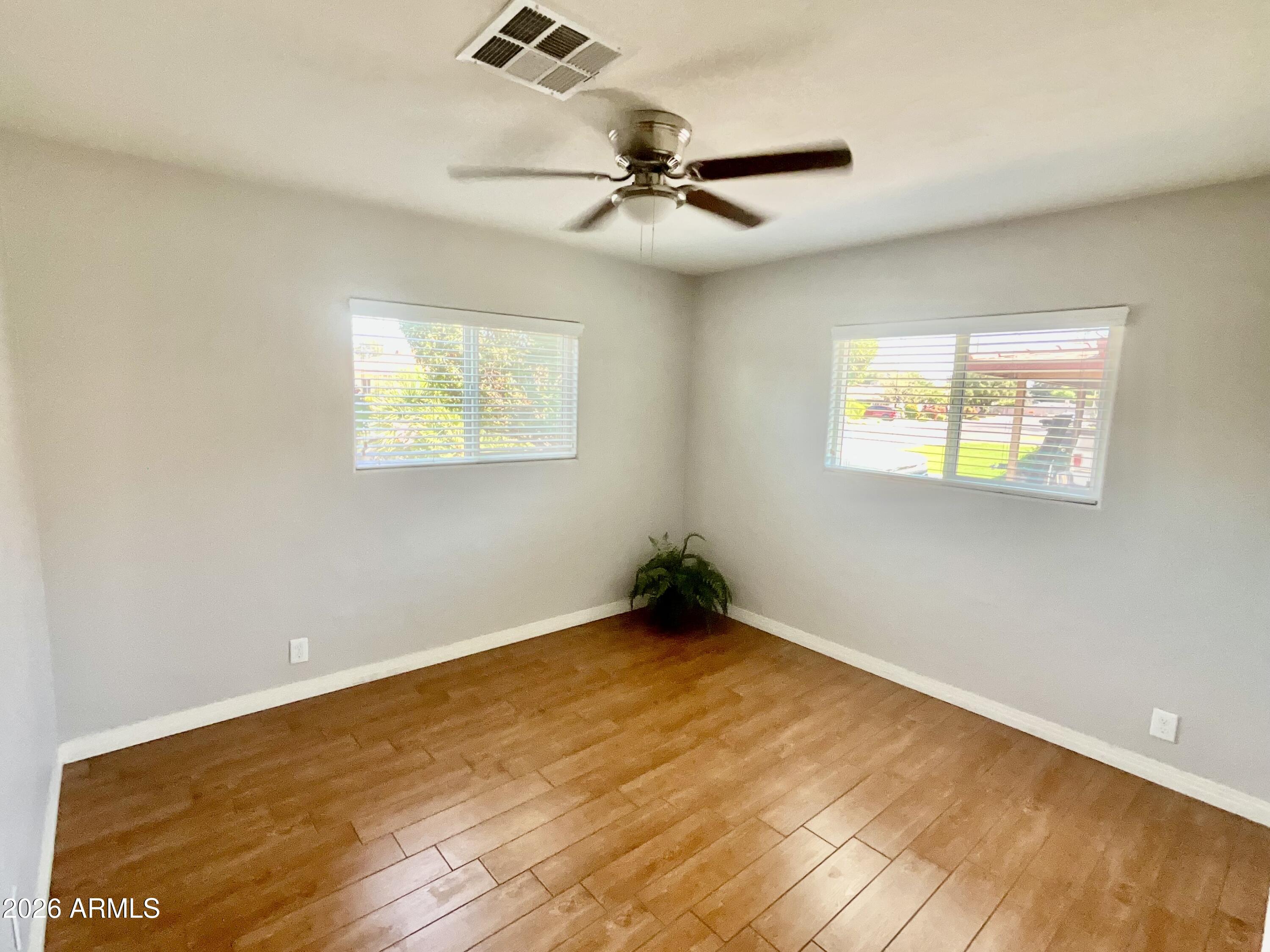 1601 West Lamar Road Phoenix, AZ 85015 - Photo 14 of 28 a view of an empty room with a window