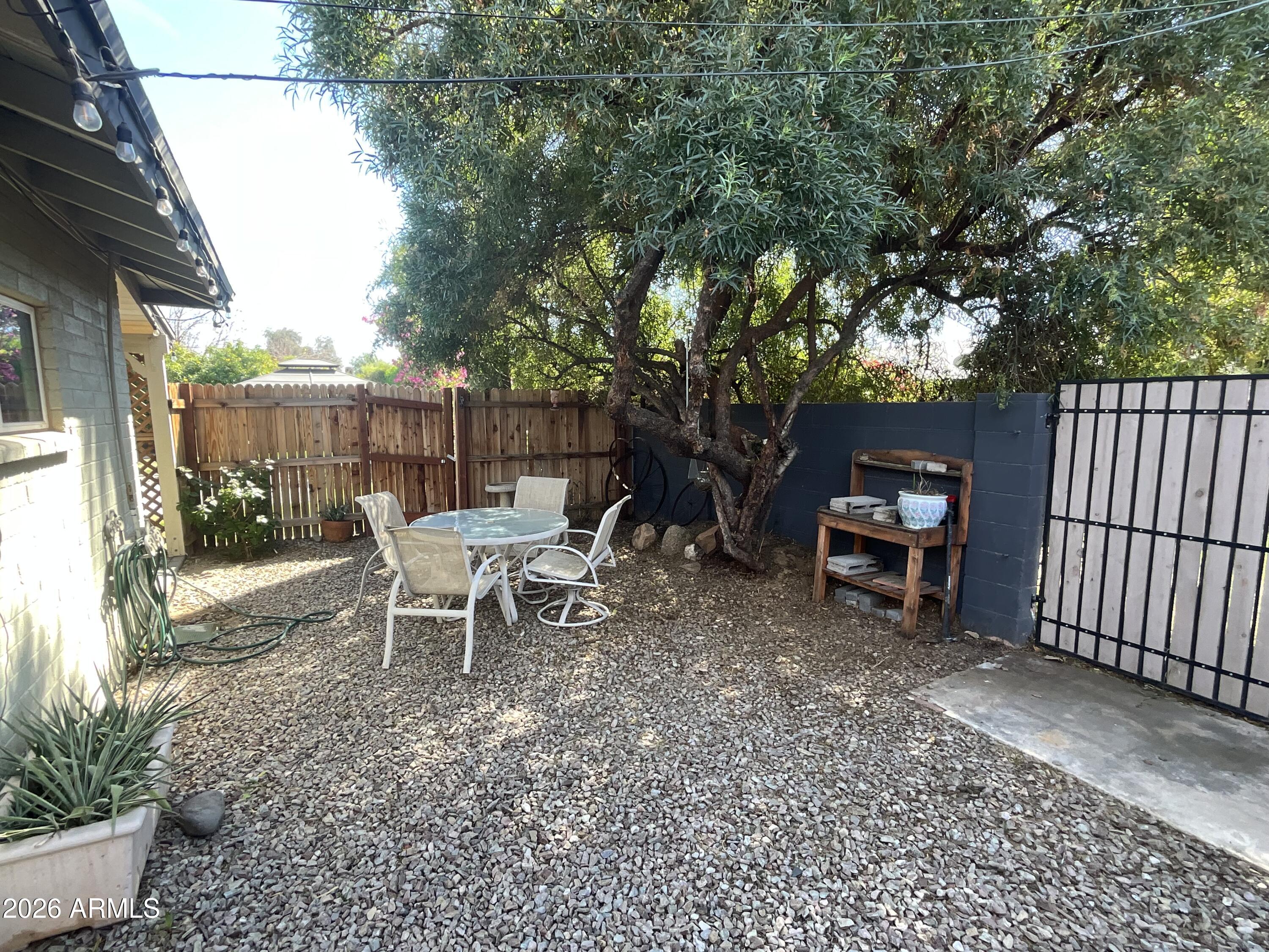 1601 West Lamar Road Phoenix, AZ 85015 - Photo 20 of 28 a view of a bench in the backyard